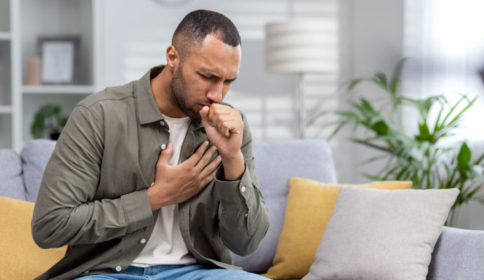 A person sitting on a sofa in a room