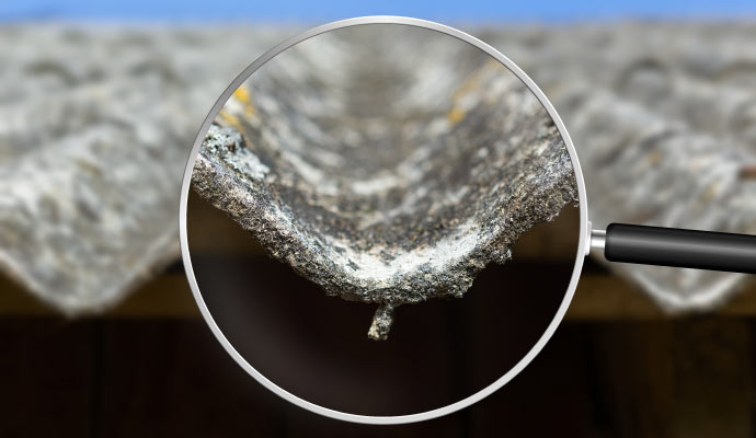 Magnified asbestos fibers on damaged shingles