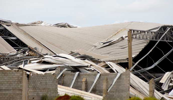 An industrial building with a collapsed roof