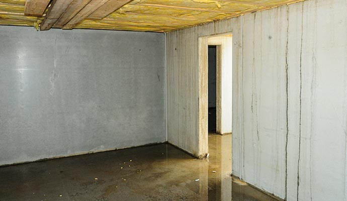 Basement flooding with standing water Basement floor covered with flood water