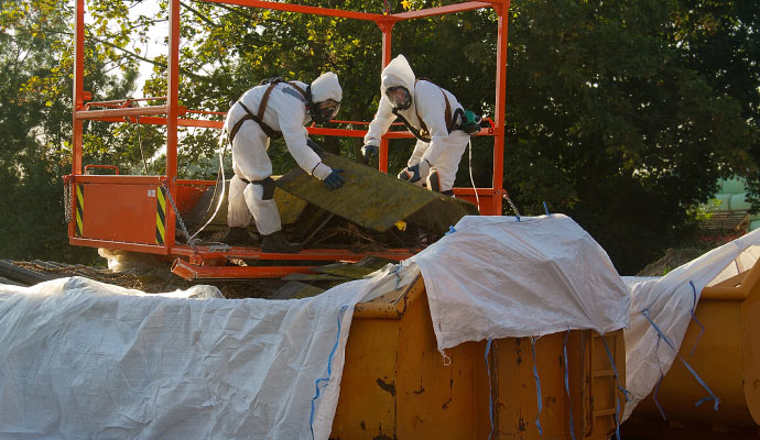 The team members are removing asbestos waste