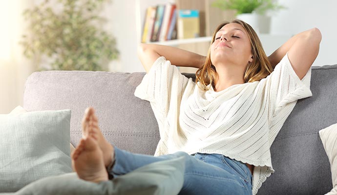 A person relaxing on a sofa