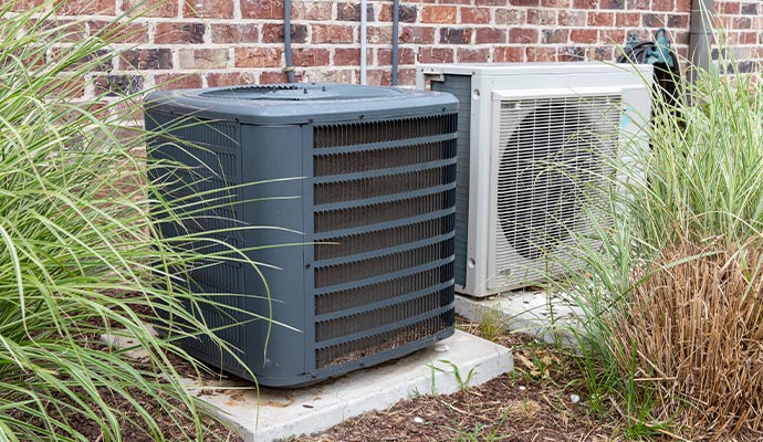 Two air conditioning units installed outside