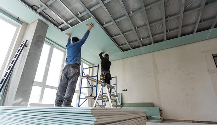 Professional team installing new ceiling